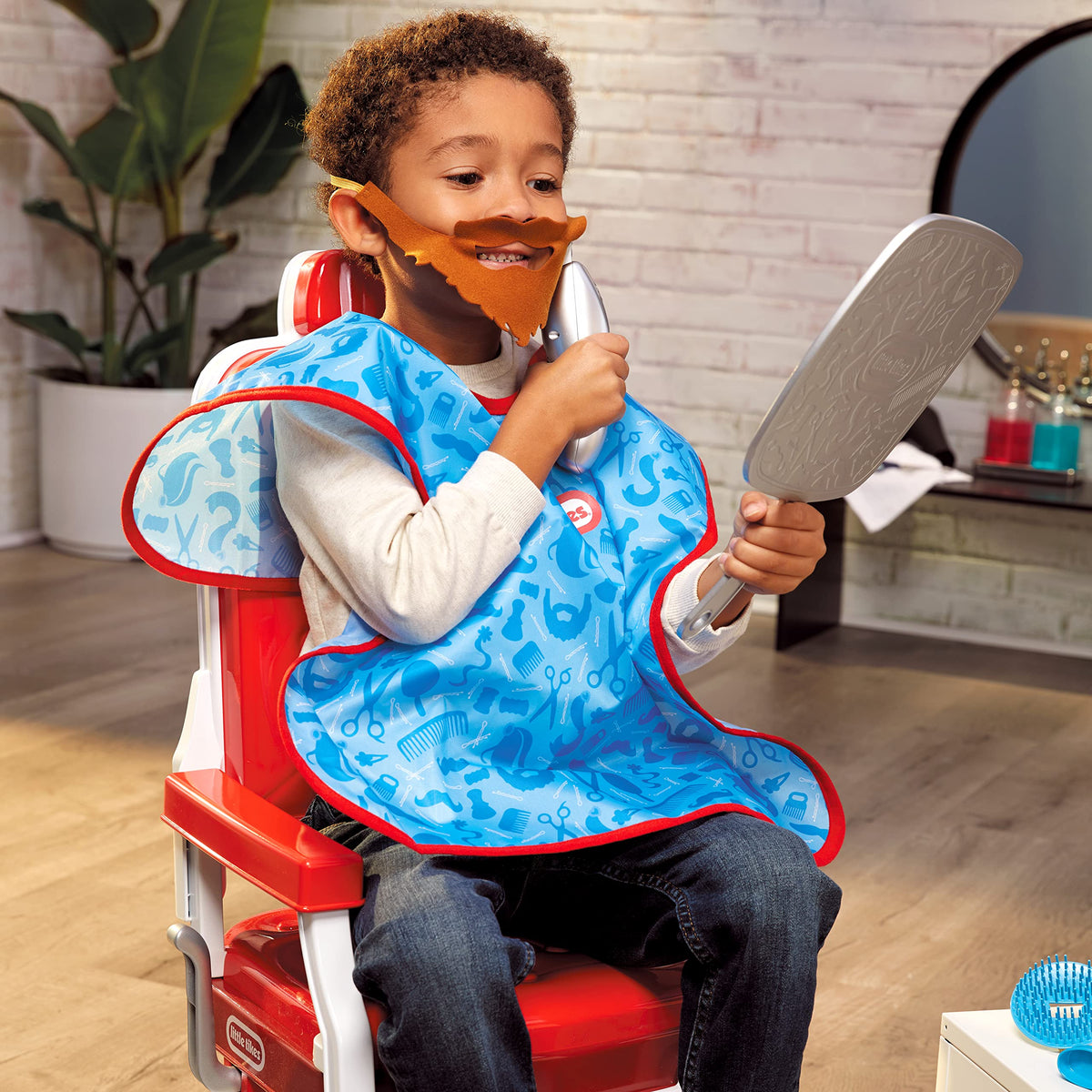 Little Tikes Style Station vibrating clippers add lifelike grooming vibes.