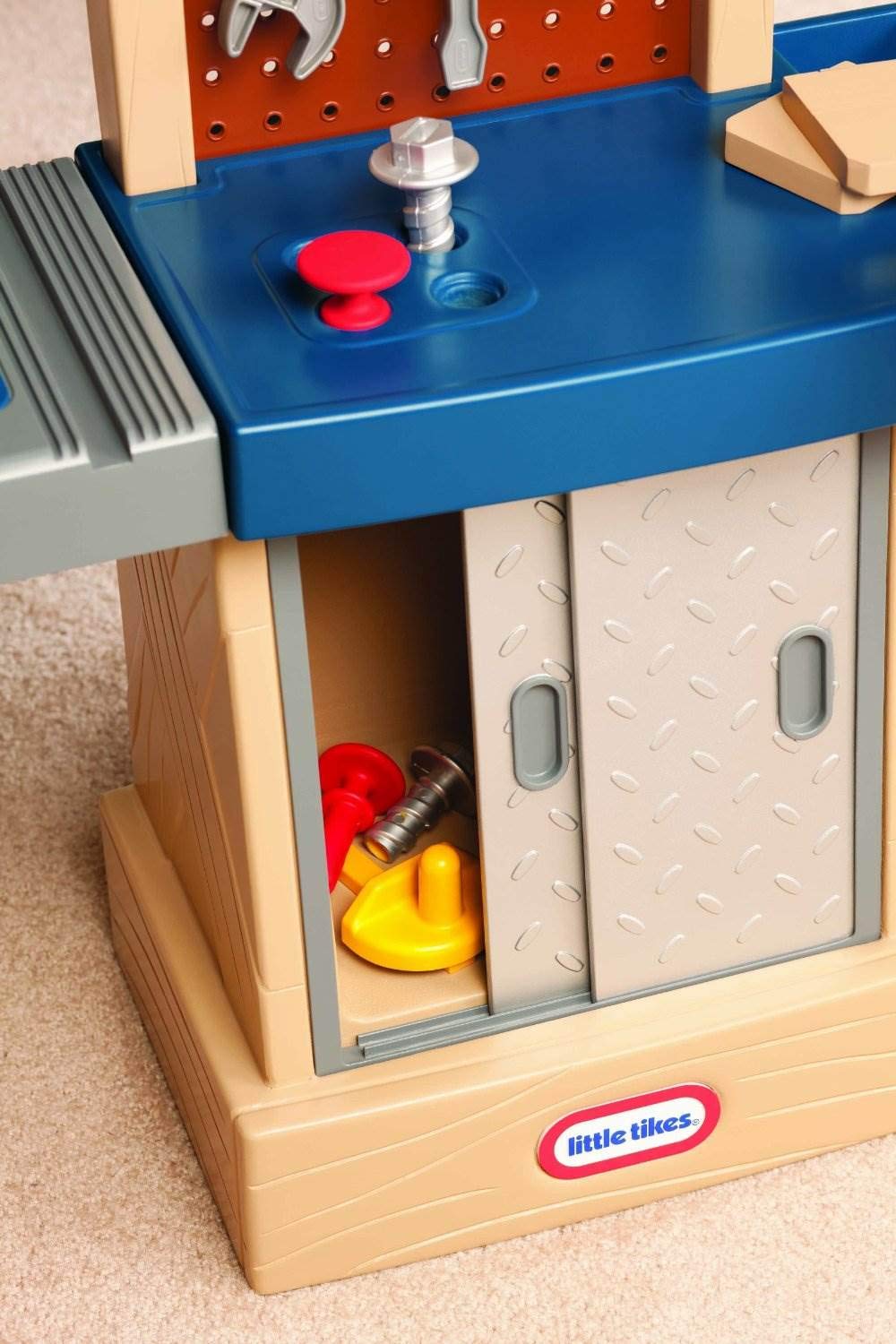 Little Tikes Tough Workshop Beige saw pretend board promotes imaginative building.