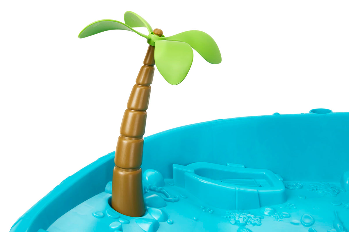 Little Tikes Waterfall Island Water Table cave tunnel offers underwater creature exploration.