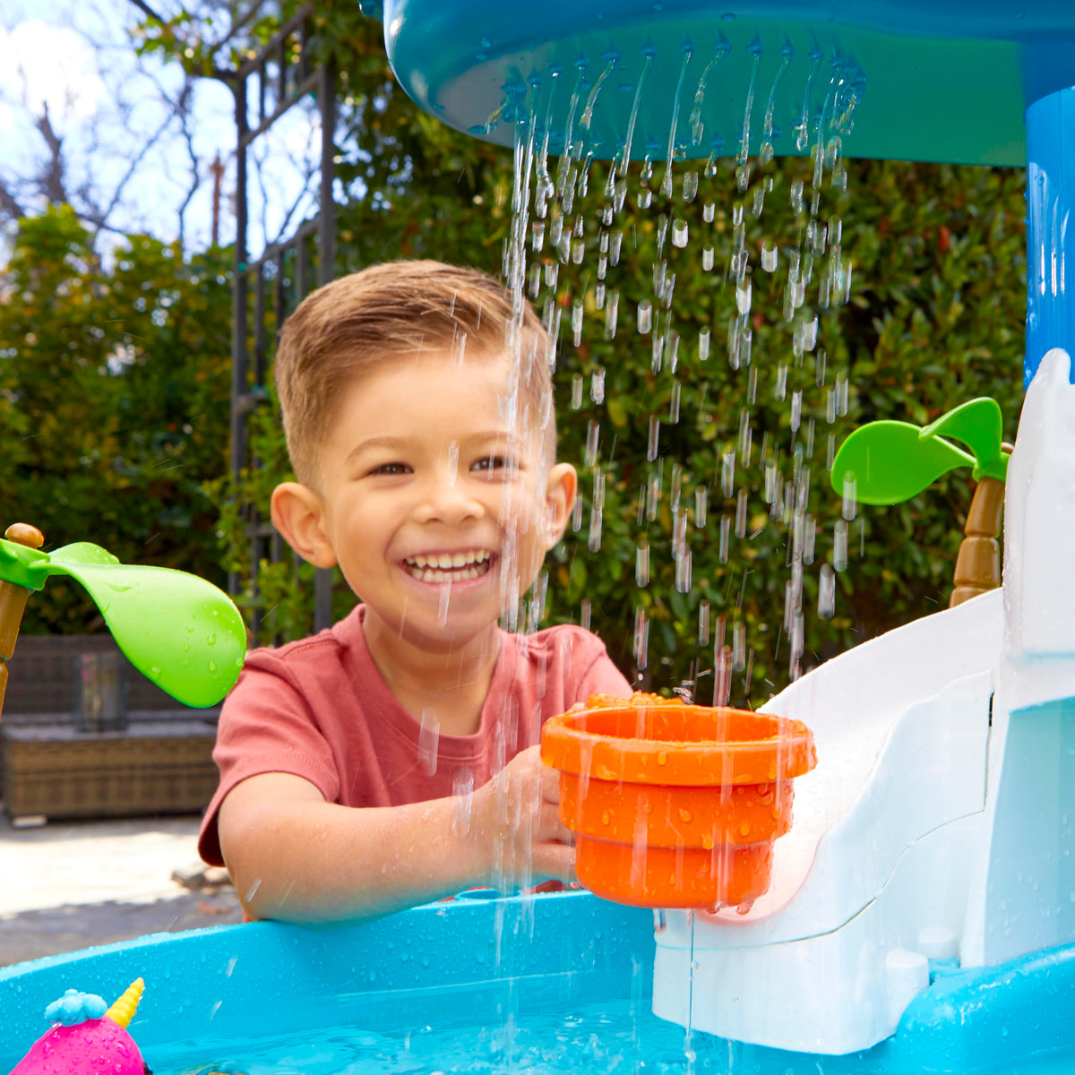 Little Tikes Waterfall Island Water Table narwhals invite storytelling and pretend sea adventures.