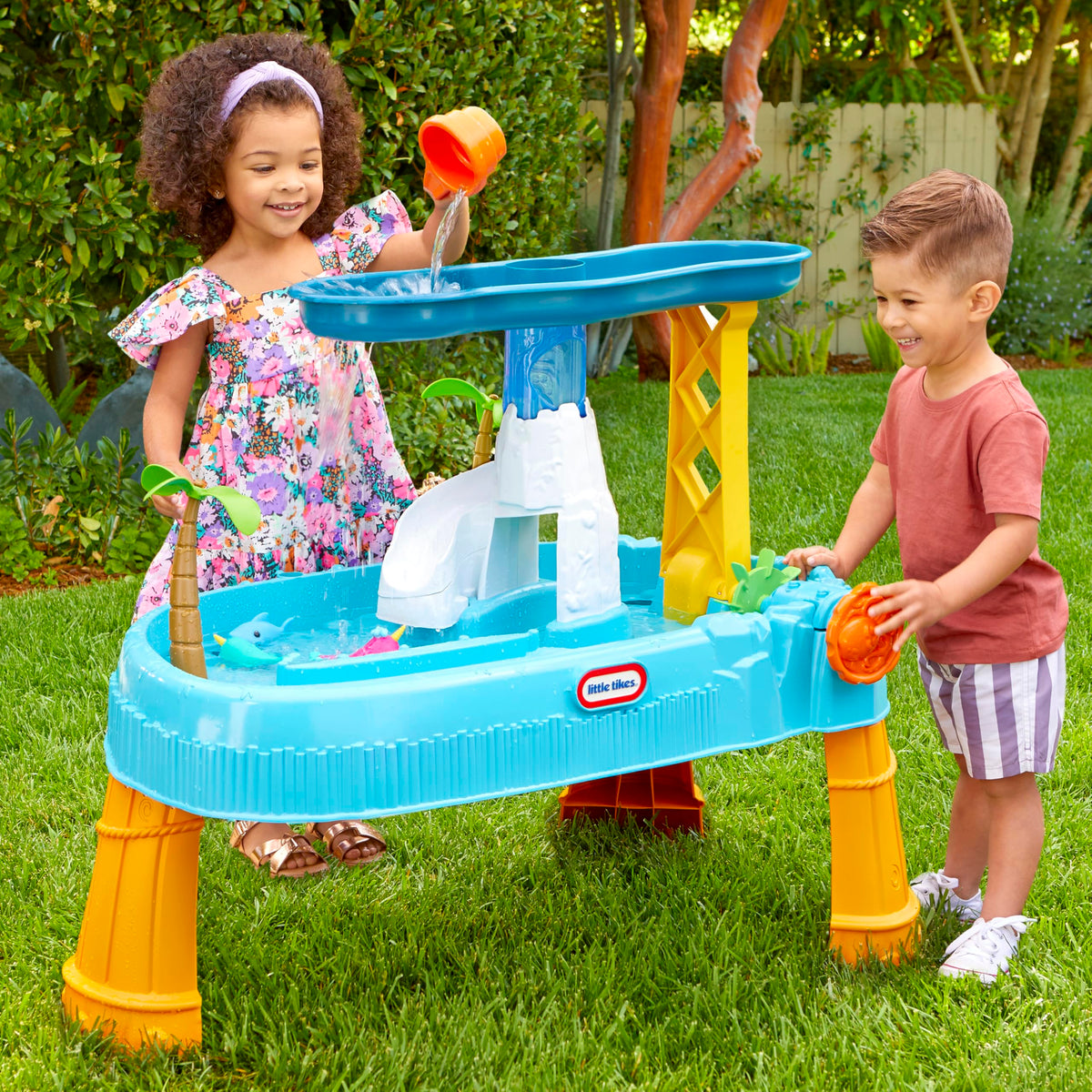 Little Tikes Waterfall Island Water Table palm trees spin treetops, sparking motion-filled play.