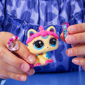 Collector card included with pet name, personality, rarity, and level