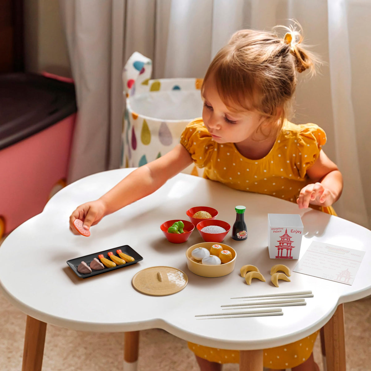 Lollipop Dumpling Palace dining setup emphasizes sharing during family-style pretend meals.