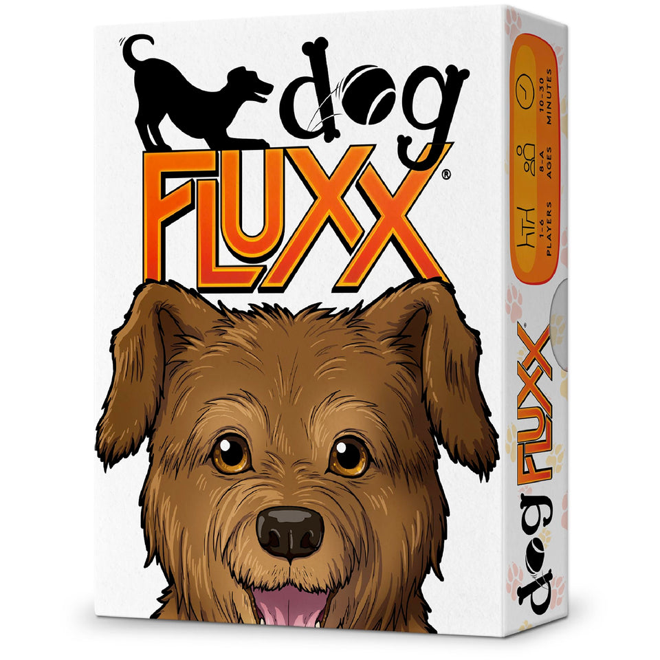 Looney Labs Dog Fluxx game box and deck on a coffee table for family fun.