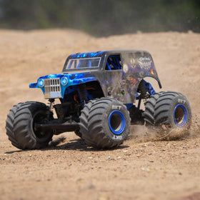 Losi 1/18 Mini LMT Son Uva Digger LED headlights illuminate at dusk.