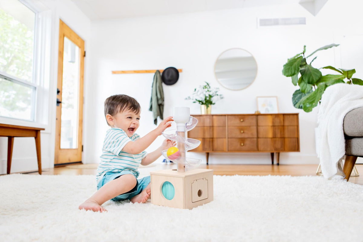 Lovevery Babbler Play Kit Posting Lid develops hand-eye coordination
