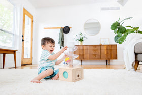 Lovevery Babbler Play Kit Posting Lid develops hand-eye coordination