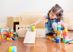 Lovevery The Block Set pull car transformation invites planning and sequence-based play.