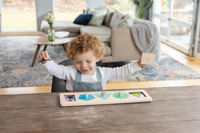 Lovevery Friends of All Shapes Puzzle: diverse Montessori imagery supports real-face recognition.