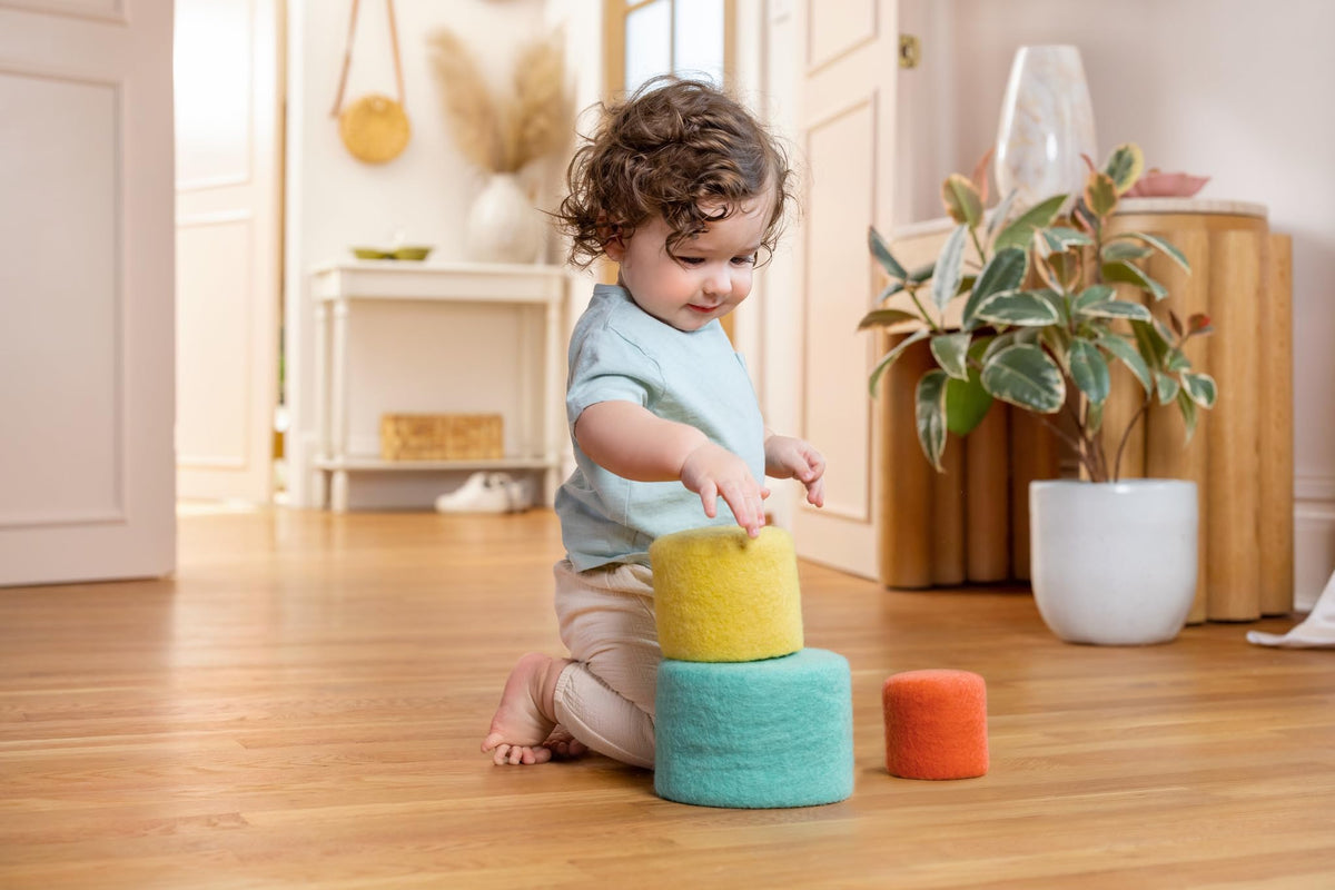 Lovevery Nesting Felt Baskets demonstrating containment and nesting concepts for toddlers.