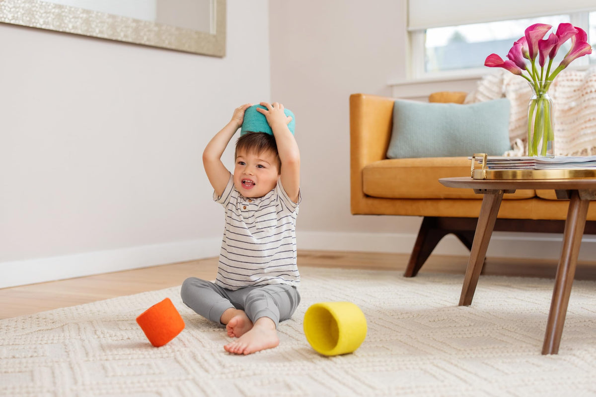 Lovevery Nesting Felt Baskets using hats or boats in pretend play.