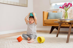 Lovevery Nesting Felt Baskets using hats or boats in pretend play.