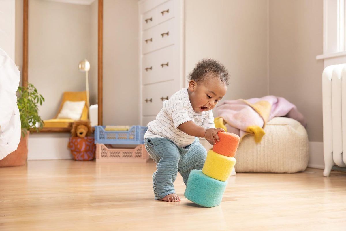 Lovevery Nesting Felt Baskets showing toddler nesting progress during play.