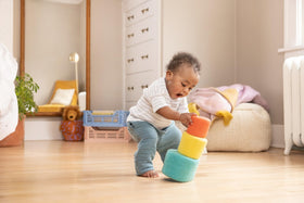 Lovevery Nesting Felt Baskets showing toddler nesting progress during play.