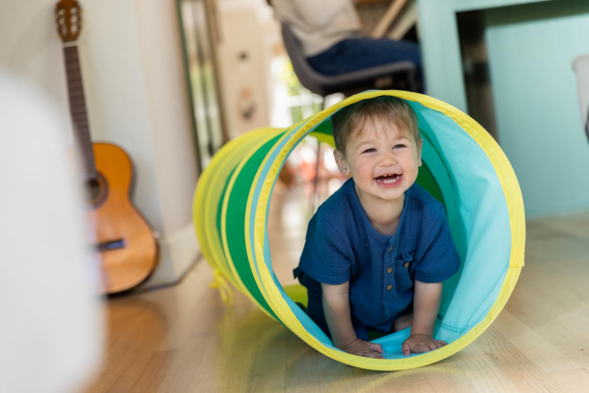 Lovevery Organic Cotton Play Tunnel multicolor adds cheerful energy to playtime.