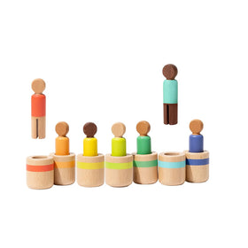 Lovevery wooden peg dolls balancing activity encouraging problem-solving.