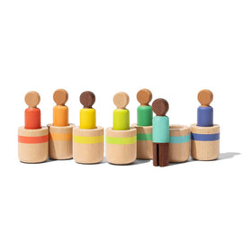 Lovevery Post & Play peg dolls for color matching exploration and fine motor growth.