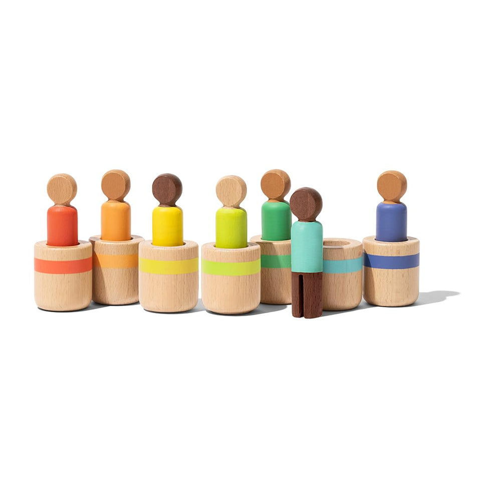 Lovevery Post & Play peg dolls for color matching exploration and fine motor growth.