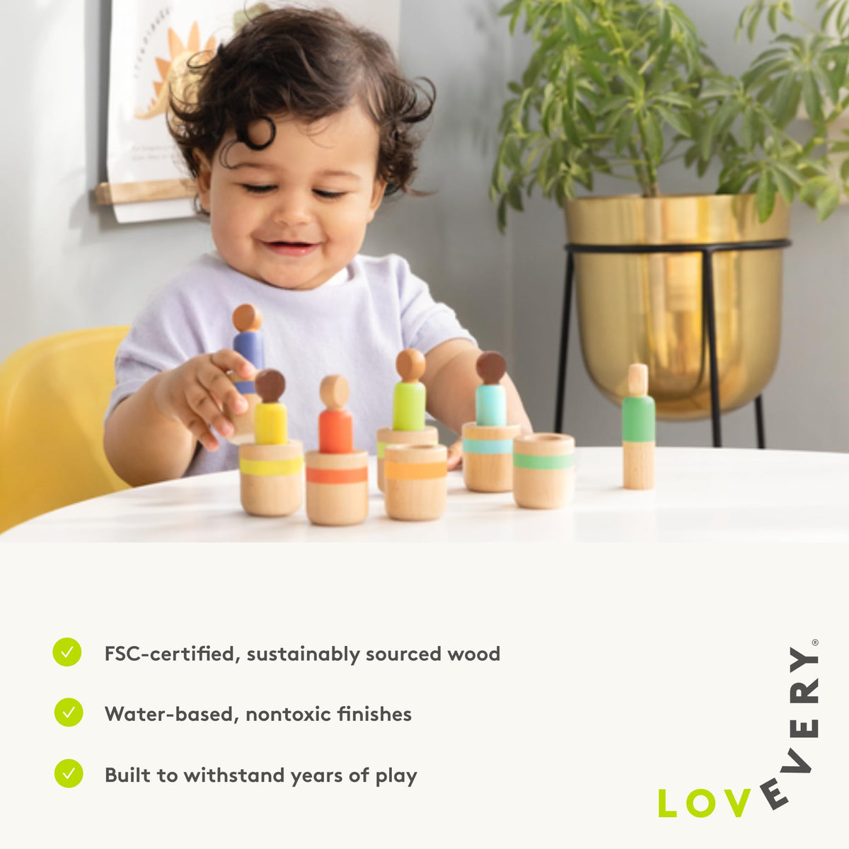 Lovevery peg dolls in a stacking sequence to enhance hand-eye coordination.