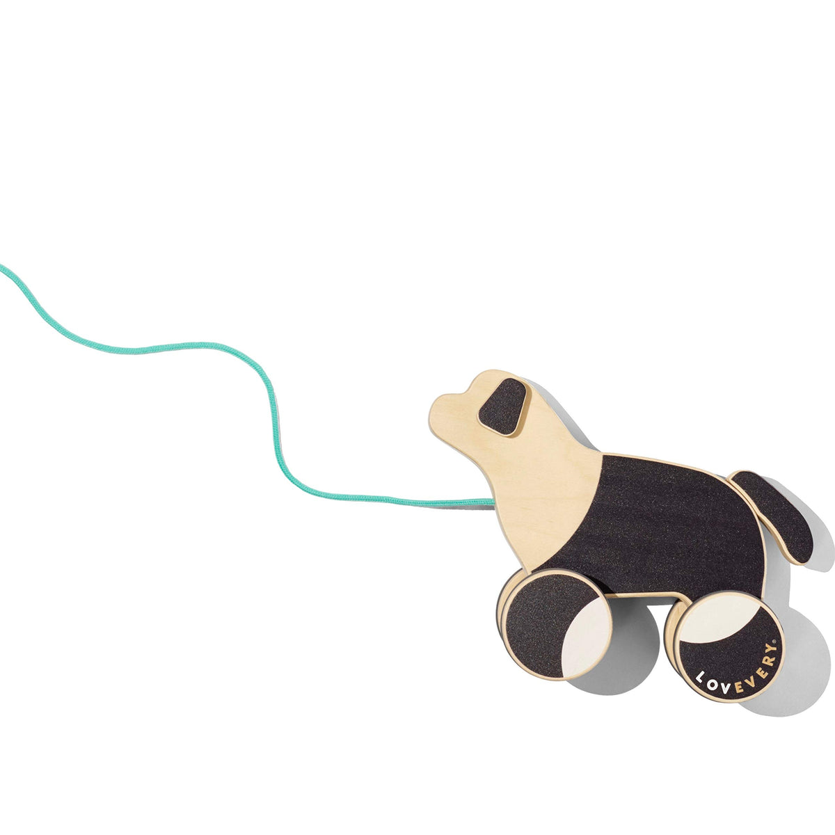Lovevery The Pull Pup wooden pull toy on the floor praises imaginative play and walking practice