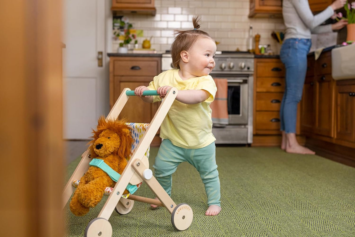 Lovevery The Buddy Stroller buckle detail, quick secure fastening for easy setup.