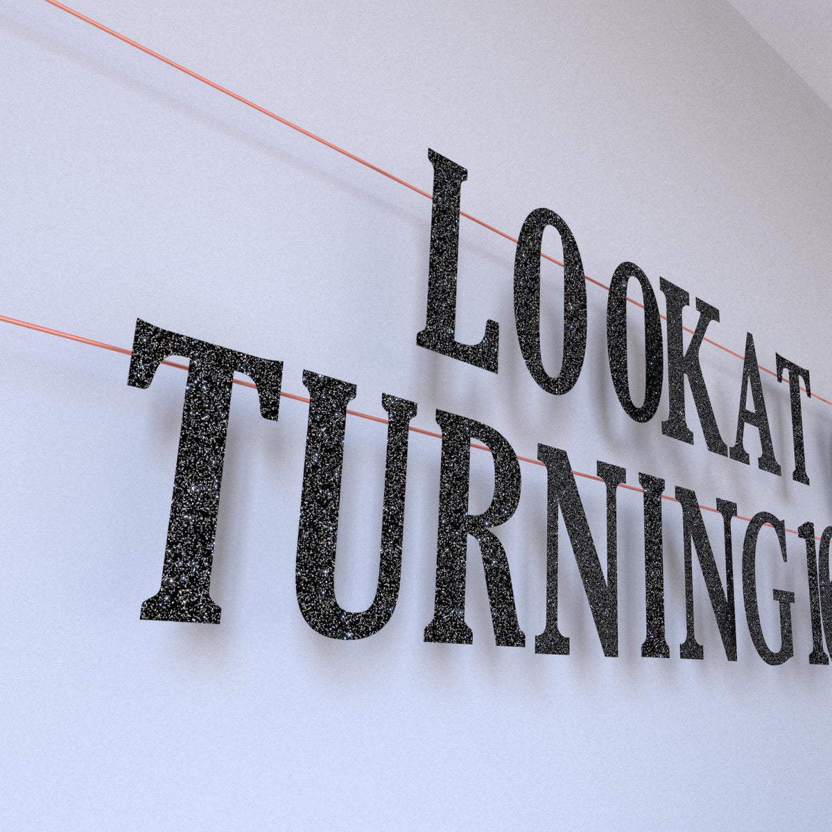 LQA Decor hanging swirls introduce movement above the table.