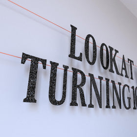 LQA Decor hanging swirls introduce movement above the table.