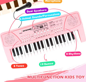 M SANMERSEN pink keyboard with microphone for singing along.