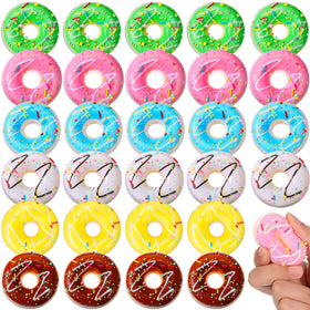 Macarrie donut stress ball pink in hand, soft tactile feel and color pop for desk use.