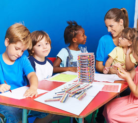 Madisi crayons shown in a classroom setup, highlighting easy distribution and use.