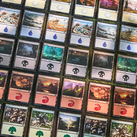 Magic MTG 2025 Land Station features all three art variants per color.