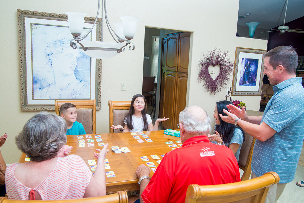 magilano SKYJO players around a table enjoying a quick game