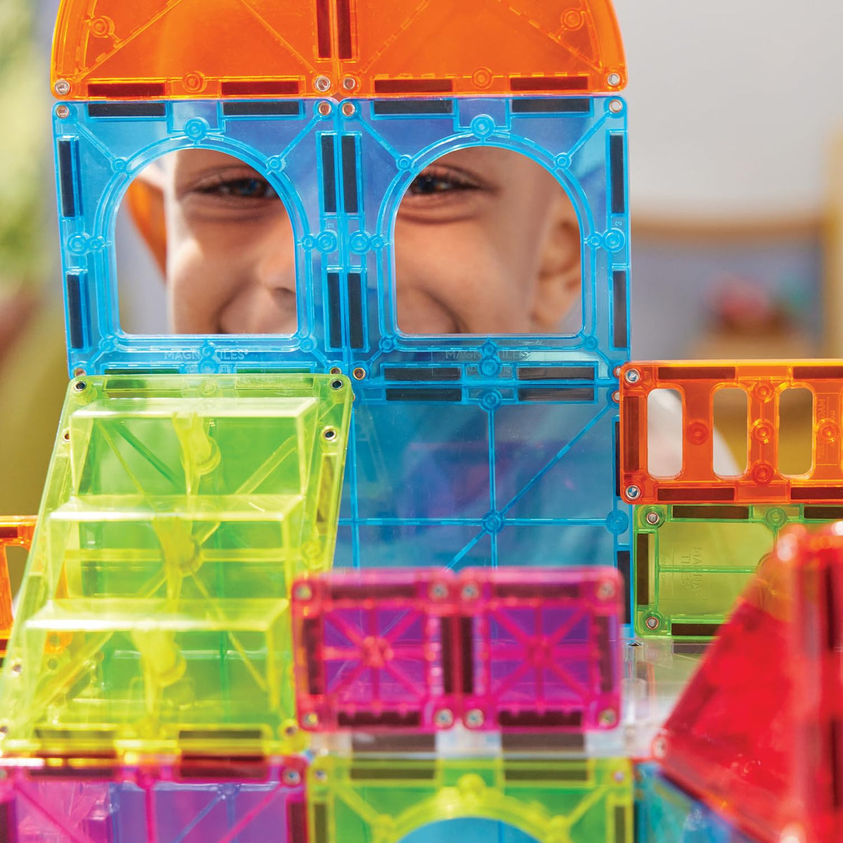 MAGNA-TILES City Center road tiles connect streets for cohesive urban layouts.