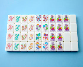 Flowers tiles showing decorative petals brighten the table during play