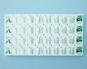 Mahjong Co Celestial flowers and jokers close-up, decorative details inviting playful hand variety.