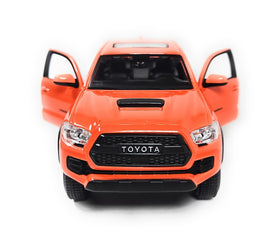 Maisto Tacoma TRD Pro 1:27 hood-open shows mechanical realism in miniature