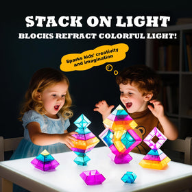 MAKE KIDS SMILE BUBBLE FUN blocks glow on light table, enhancing sensory play.