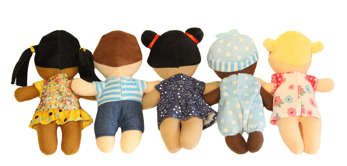 Diverse plush dolls with embroidered smiles from Making Believe Diversity Buddies.