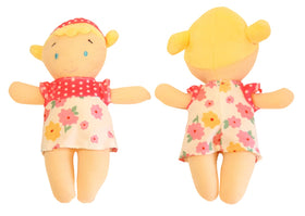 Tiny hands hug a Making Believe Diversity Buddies plush during toddler playtime.
