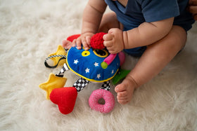 Manhattan Toy Whoozit arms textures provide multisensory grabbing and exploration for infants.