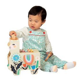 Manhattan Toy Musical Lili Llama clacking saddle blankets promote cooperative drumming moments.