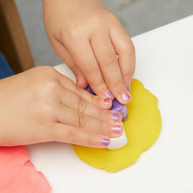 Manucurist mini brush bottles support tiny hands for precise application.