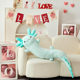 Glow-in-the-dark axolotl plush glows after light exposure for playful nighttime fun.