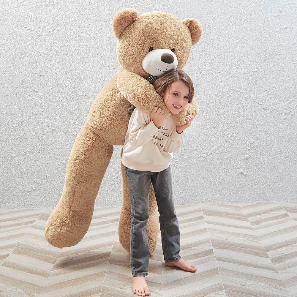 MaoGoLan big plush bear displayed in living room for cozy decor.