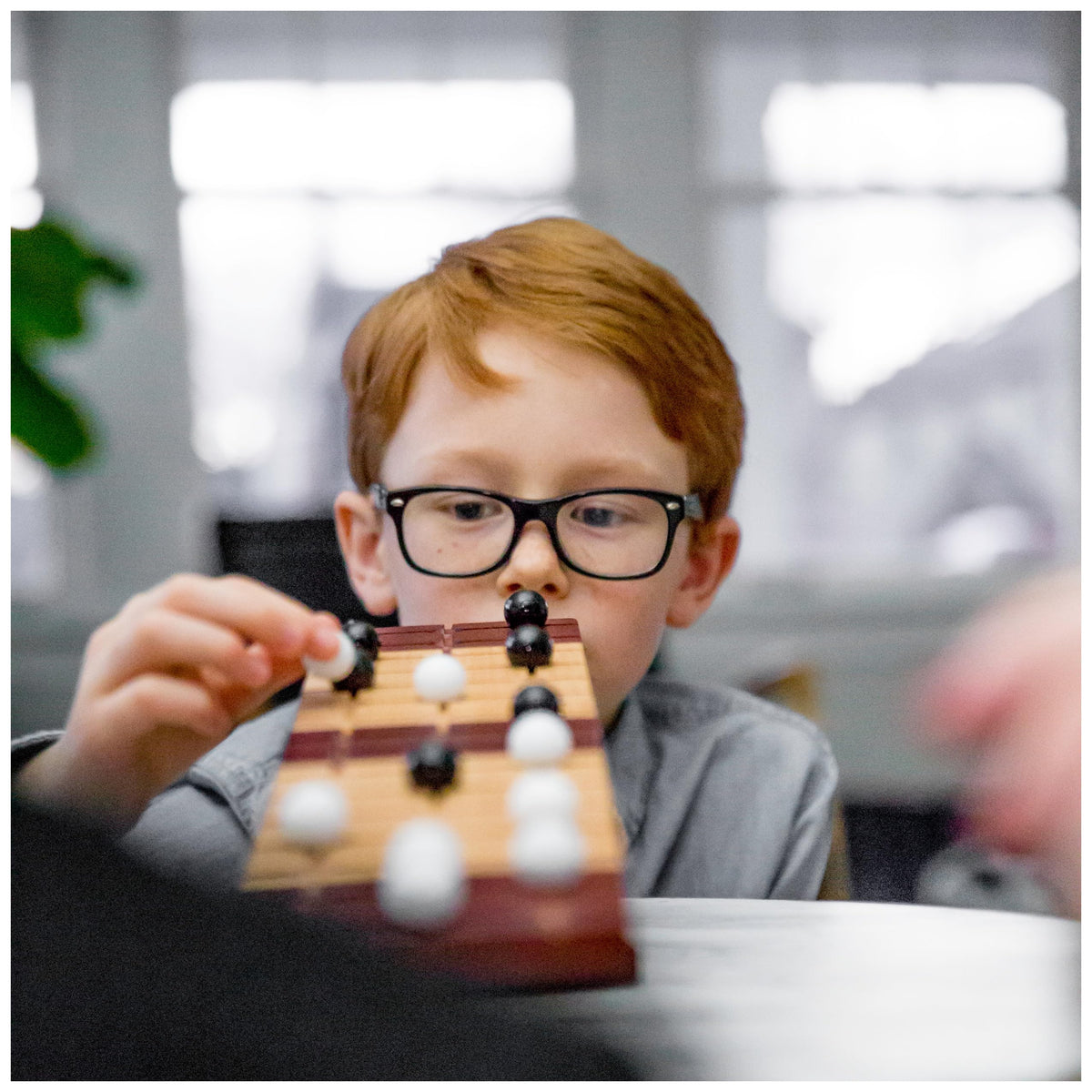 Marbles Rock Me Archimedes two-player action invites friendly competition and focus.