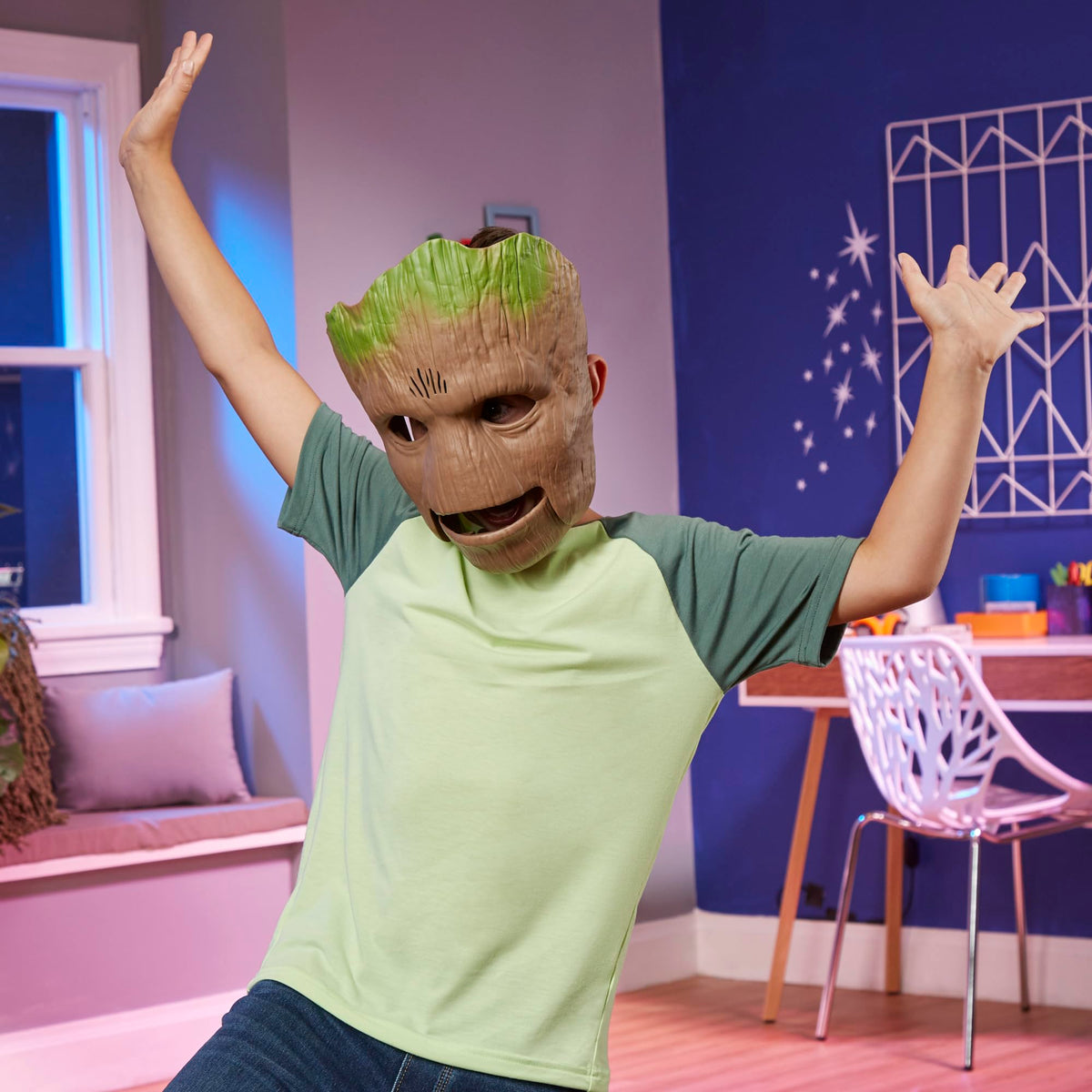 Child wearing the Groot mask ready for pretend space missions.