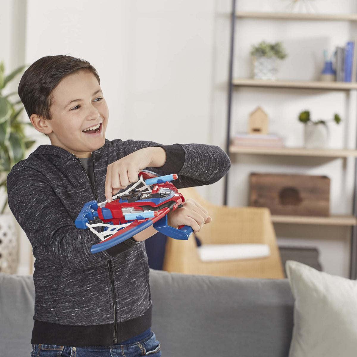 Marvel Spider-Man Spiderbolt blaster held by kids' hands