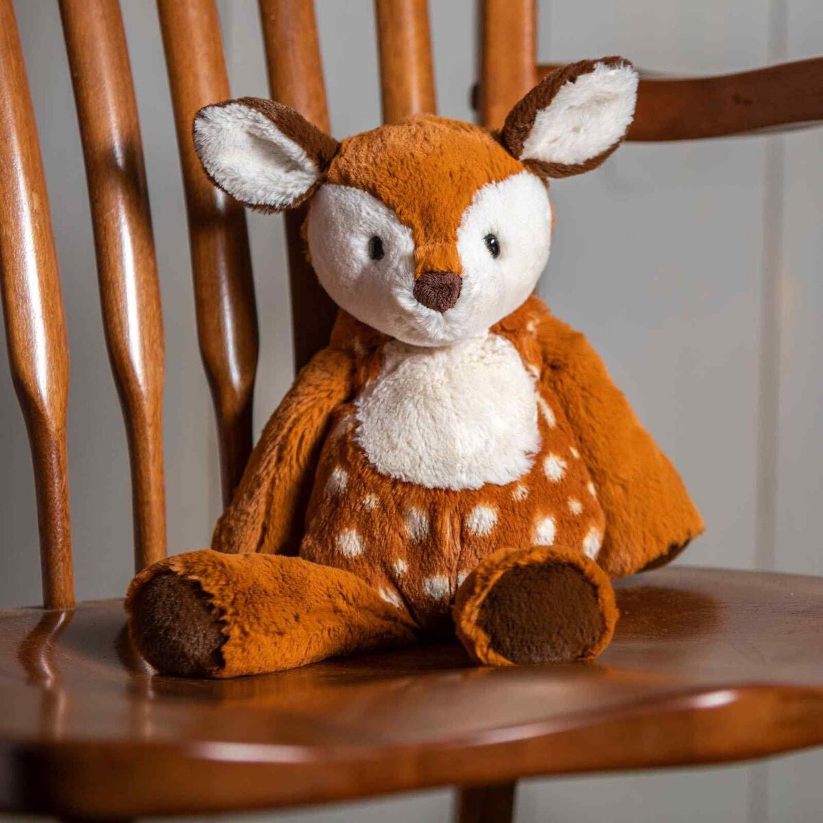 Mary Meyer Marshmallow Fawn hugging display demonstrates its huggable design and comforting appeal.