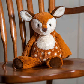 Mary Meyer Marshmallow Fawn hugging display demonstrates its huggable design and comforting appeal.