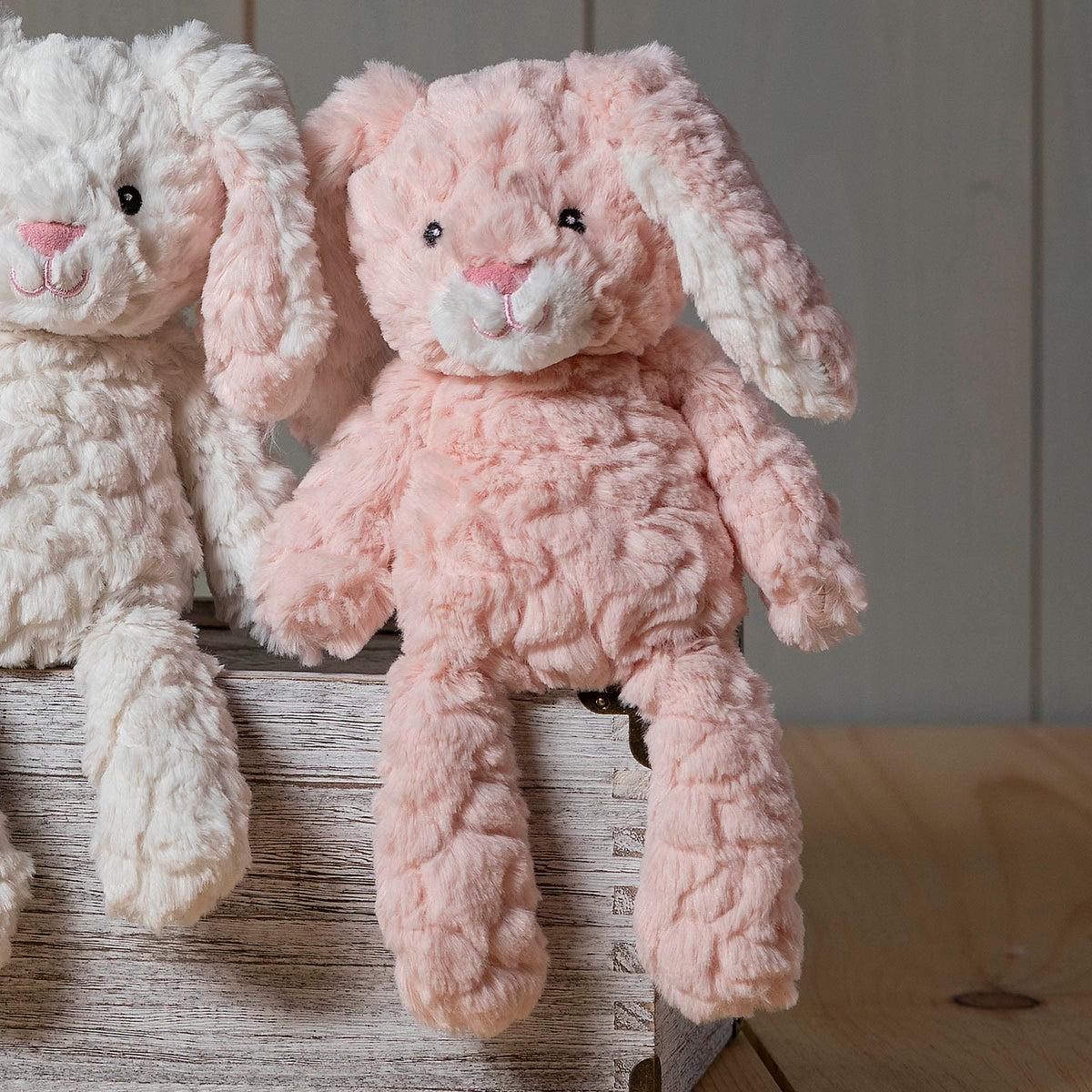 Mary Meyer Putty Pups blush bunny fabric nose showcases stitched construction for lasting play.